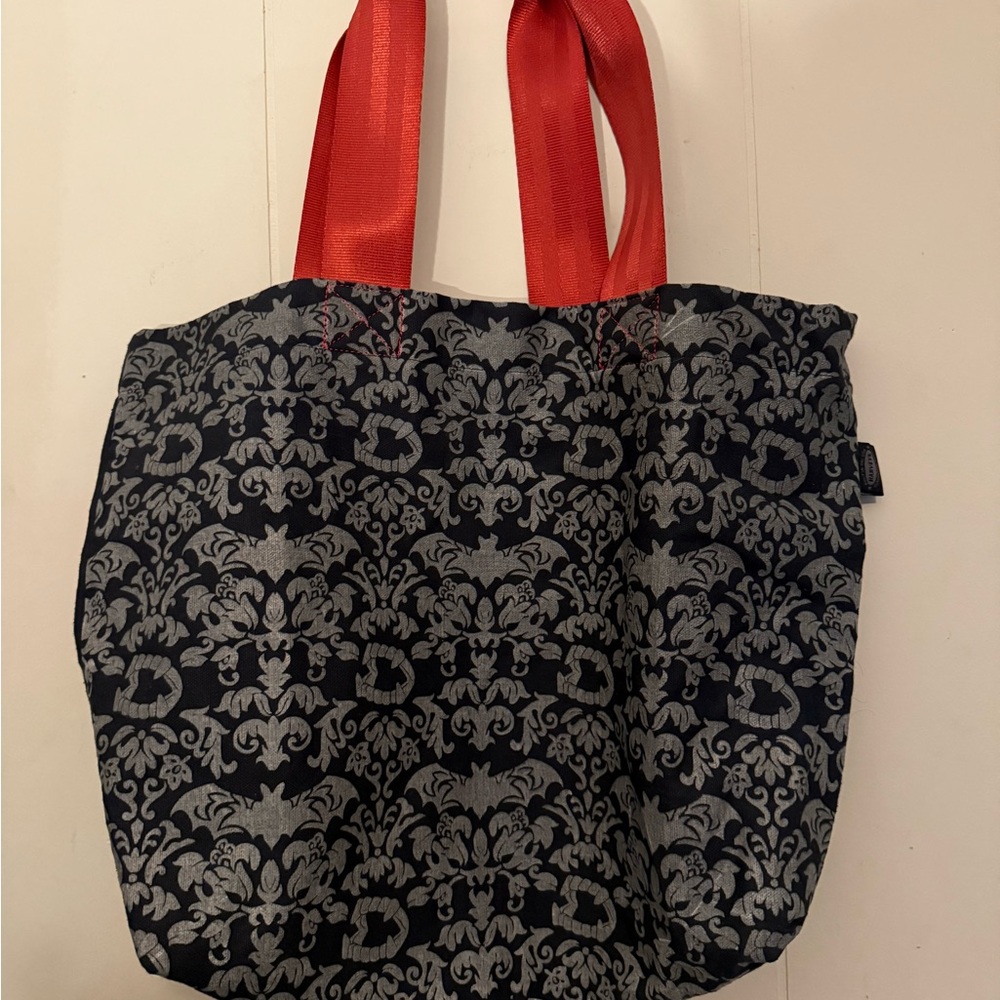Elegant Black and Silver Tote Bag with Red Handles